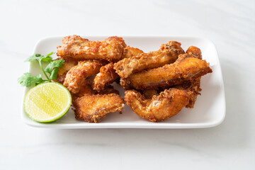 Fried Snapper Belly on white plate