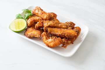 Fried Snapper Belly on white plate