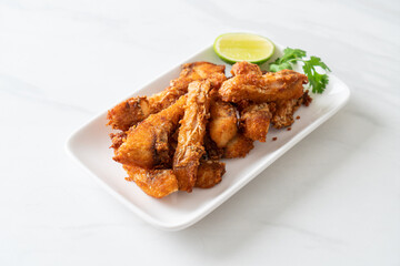 Fried Snapper Belly on white plate