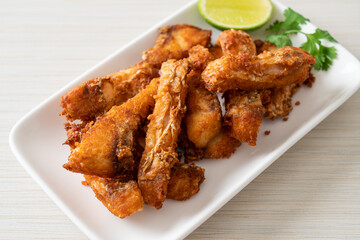 Fried Snapper Belly on white plate