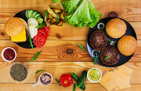 Ingredients For Burger On Wooden Background. Top View