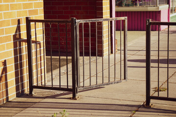 Open wrought iron gate on patio