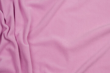 Fototapeta premium Fleece fabric blue top view. Texture of textile fleece bedspread. 