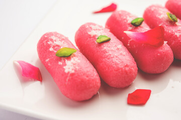 Pink Chumchum or rose flavoured chum chum or cham cham, indian and pakistani sweet