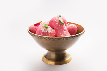 Pink Chumchum or rose flavoured chum chum or cham cham, indian and pakistani sweet