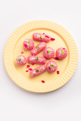 Pink Chumchum or rose flavoured chum chum or cham cham, indian and pakistani sweet