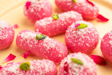 Pink Chumchum or rose flavoured chum chum or cham cham, indian and pakistani sweet - obrazy, fototapety, plakaty