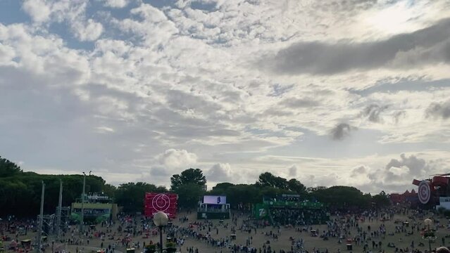 some clouds in sky with sun behind in rock in rio, Lisbon 2022. great singers playing with a good energy.