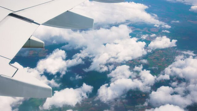 Close view of wing of unrecognizable flying airplane, seen from inside