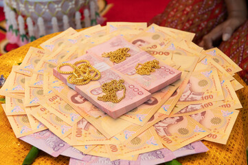 Banknotes and gold on yellow satin for weddings
