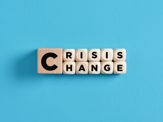 Transforming crisis into a chance for a change concept. The words crisis and change on wooden cubes.