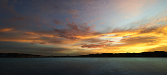 Fototapeta na wymiar Empty concrete cement floor with sunset sky .