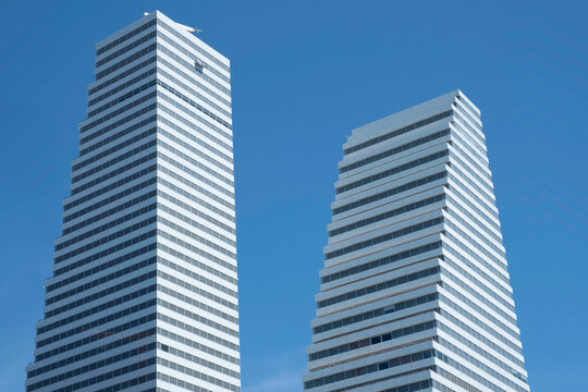 BASEL, SWITZERLAND - JULY 10 2022: Roche towers at border of Rhine River. Hoffmann-La Roche AG is a Swiss multinational healthcare company with a headquarter in Basel