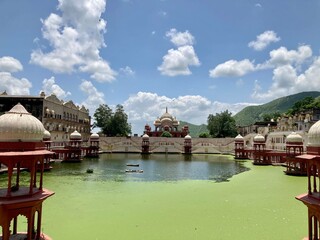 Alwar, Rajasthan 21 Jun 2021: City palace and lake (green pond) in Alwar. Rajasthan, India - obrazy, fototapety, plakaty