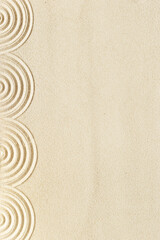 Fototapeta na wymiar Top view pattern in Japanese Zen Garden with close up concentric circles on sand for meditation and relaxation. Aesthetic minimal sand background with copyspace, beige neutral tones.