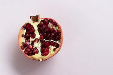 Ripe fresh sliced pomegranate fruit isolated on white background