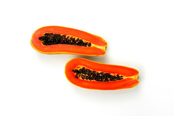 Two pieces of papaya slices isolated on white background, Fresh delicuise papaya cuts in the center of BG, top view angel