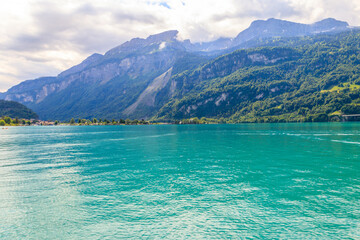 Naklejka na ściany i meble View of the Lake Brienz and Swiss Alps in Brienz, Switzerland