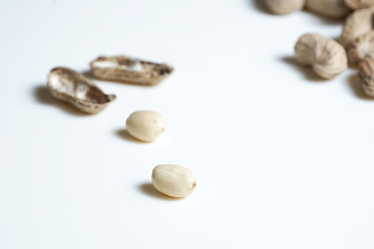 Peanuts background. Close up of a bunch of peanuts isolated over white