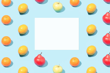 Creative summer mockup - blank white leaf on ripe fruit background