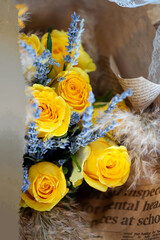 Bouquet of yellow roses and lavender. Floral shop concept