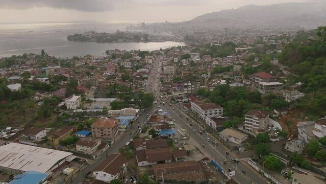 Aerial footage of a busy road in Freetown, Sierra Leone in the morning mist.
