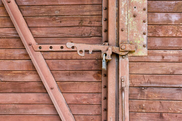 wooden railway freight car door lock with metal seal.