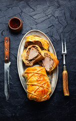 Wellington pork, pork tenderloin baked with mushrooms in puff pastry.