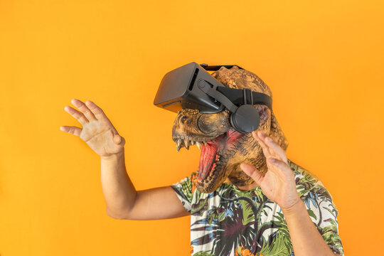 Man enjoying with virtual reality goggles.Unrecognizable male with animal mask using VR headset
