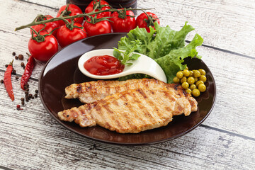 Grilled pork steak with ketchup