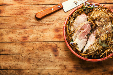 Spicy pork roast in herbs.