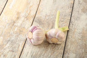 Two Young garlic over background