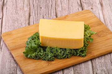 Tasty yelloow Tilsiter cheese brick