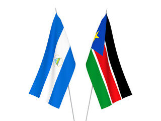 National fabric flags of Republic of South Sudan and Nicaragua isolated on white background. 3d rendering illustration.