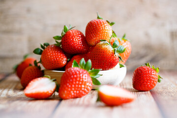 Fresh strawberries on wooden table.