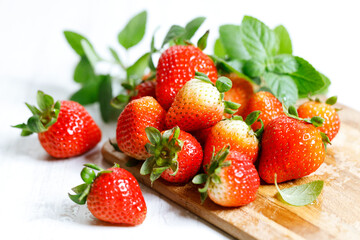 Fresh strawberries on wooden table.