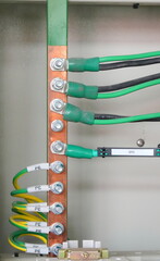Grounding electric bar, cables connected to copper busbar ground.