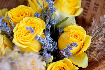 Bouquet of yellow roses and lavender. Floral shop concept