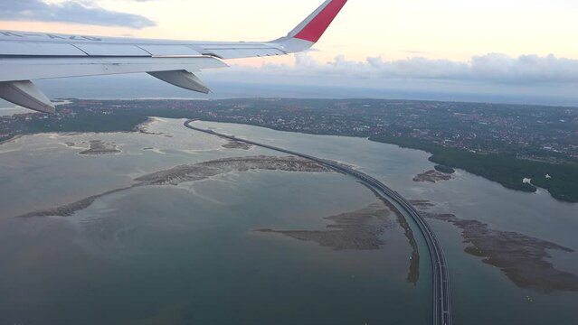 Bali Mandara Toll Road, aerial view with the plane wing
