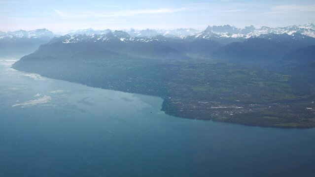 French coast of Geneva (Leman) lake including Evian and Thonon-les-Bains with the Alps in the background, aerial view