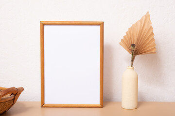 Mock up empty wooden frame mockup, paper palm leaf and on white background, interior, home design. Art concept. copy space