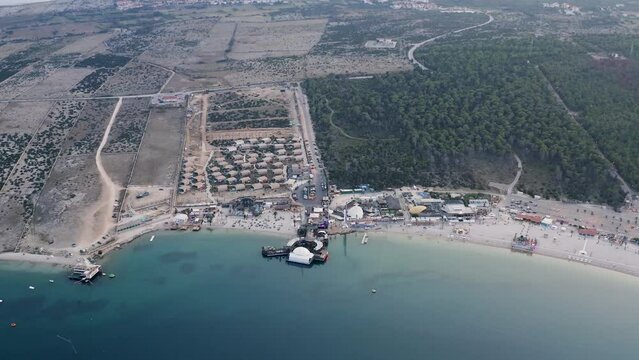 downward tilting aerial view over the long pebble beach on the adriatic island of Pag called zrce festival coast in croatia