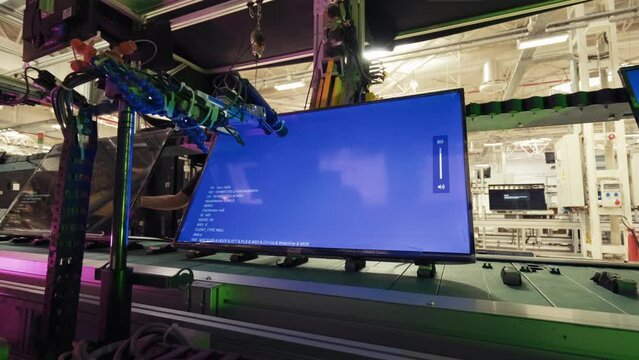 TV LEDS in electronics production line on modern factory.Robotic technology of Electronic Led Board TV Factory.4K.1
