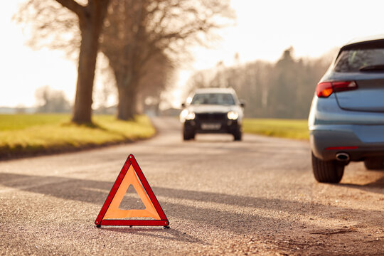 Hazard Warning Triangle Sign Warning Of Car Breakdown On Country Road