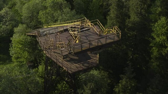 Starting Platform And Landing Slope Of A Old Ski Jumping Hill In The Forest Of Bakuriani In Georgia. aerial drone orbit