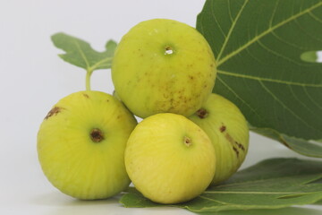 fig fruits  and leaves on white background