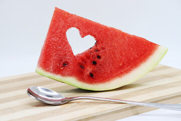 Red juicy watermelon with carved heart shape