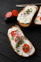 Toasts with microgreens on the table. Healthy food, vegan food and dieting concept.
