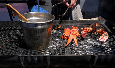 Lobster on a barbecue grill being prepared