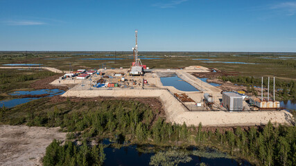 oil and gas drilling platform in the summer tundra